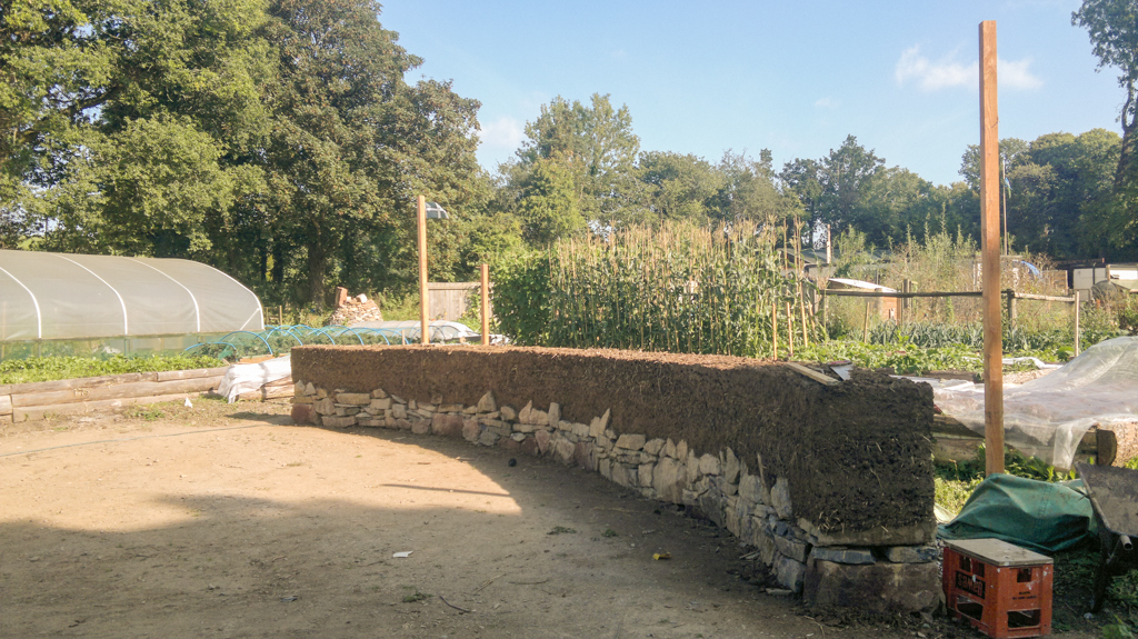 Cob wall land art sculpture based at LandWorks, Dartington Hall Estate.