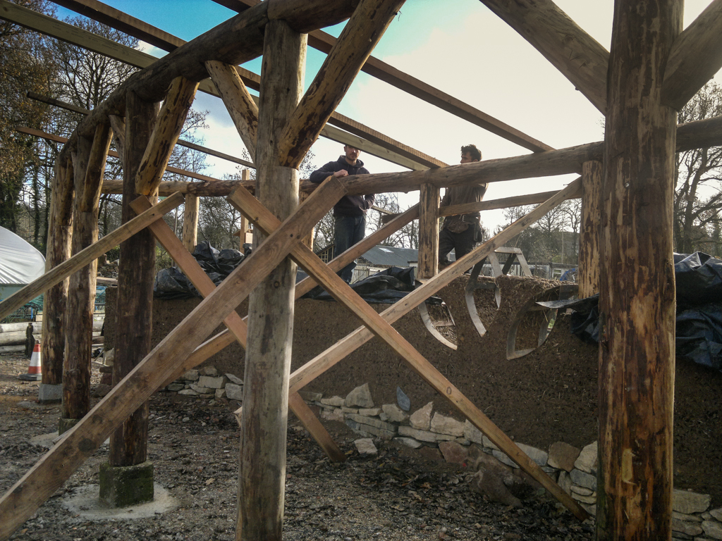 Simon and Jakob putting the rafters on. Timber frame land art sculpture
