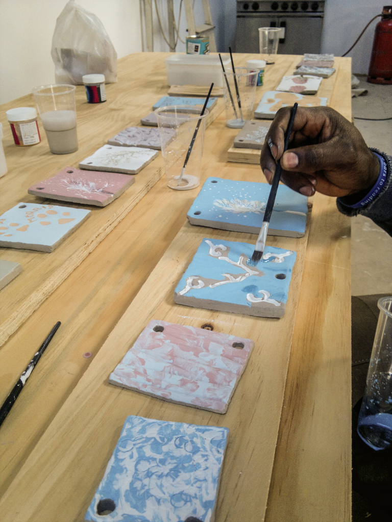 98 hand-made and painted ceramic tiles later...